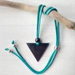 Shungite Feminine Triangle Pendant on turquoise leather cord with sterling silver bead ends and stopper bead